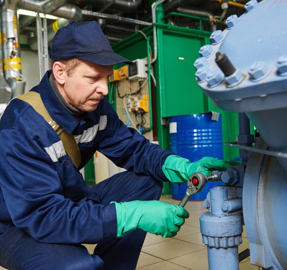 Technician performing chiller replacement services in Clayton, NC