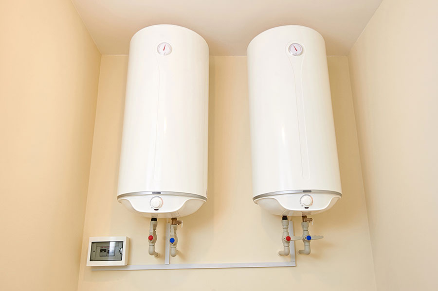 Water heaters mounted to a wall in Durham